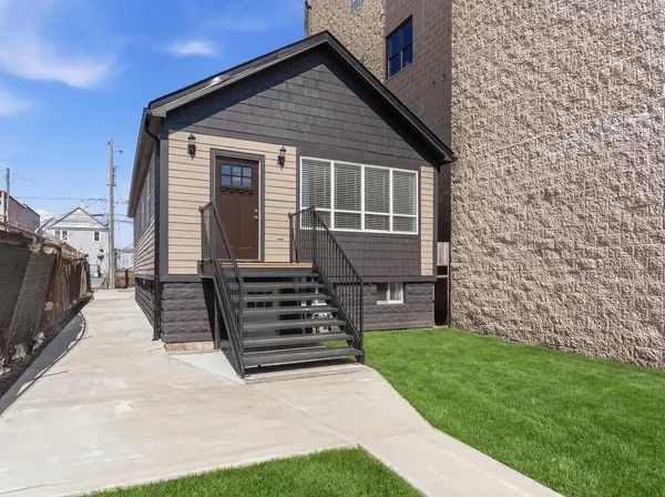 a front view of a house with a yard