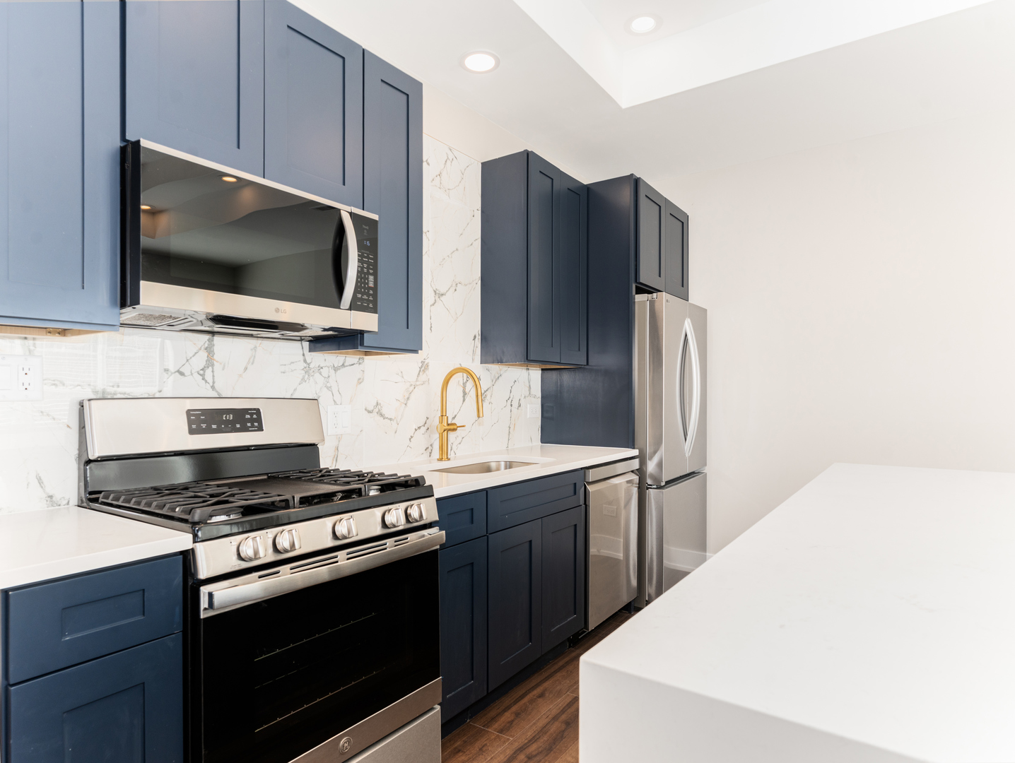 638 West 47th Street Chicago, IL 60609 - Photo 7 of 24 a kitchen with stainless steel appliances a refrigerator stove and microwave