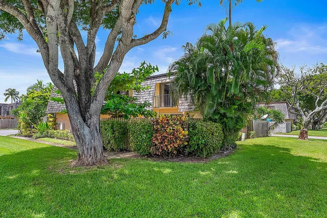 front view of a house with a garden