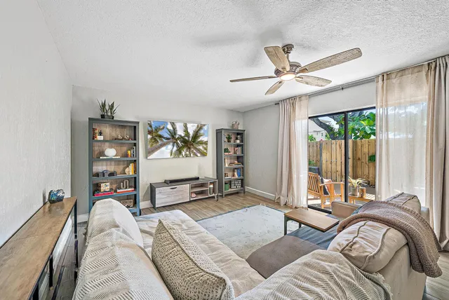 a bedroom with a bed furniture and a large window