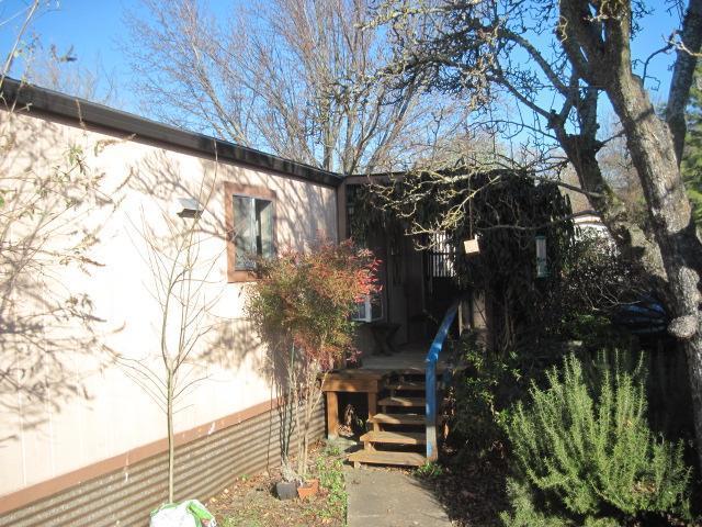 939 South Valley View Road, Unit 6 Ashland, OR 97520 - Photo 4 of 14 a backyard of a house with lots of green space