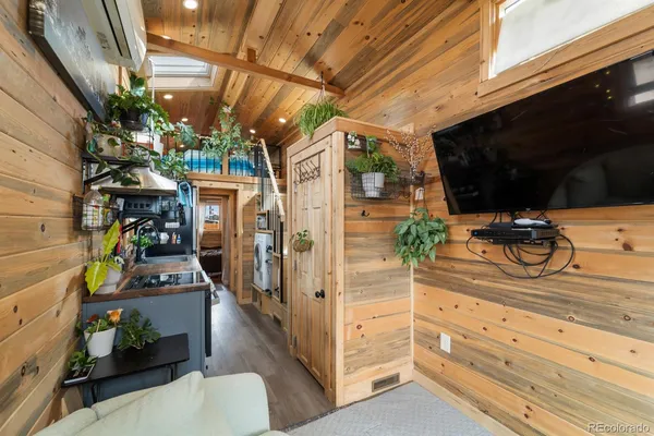 a view of a storage room with wooden floor