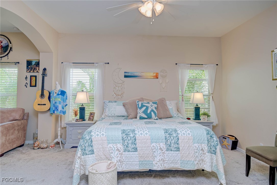 9005 Falcon Pointe Loop Fort Myers, FL 33912 - Photo 15 of 39 a bedroom with a bed and window