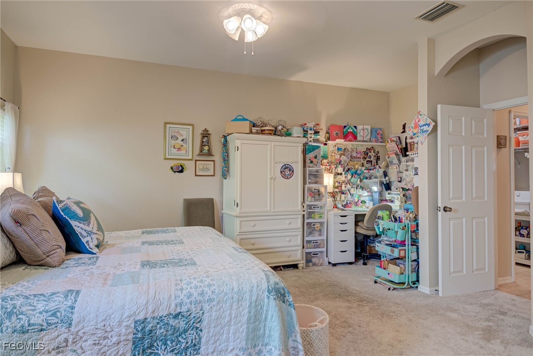 9005 Falcon Pointe Loop Fort Myers, FL 33912 - Photo 17 of 39 a bedroom with a bed and a window