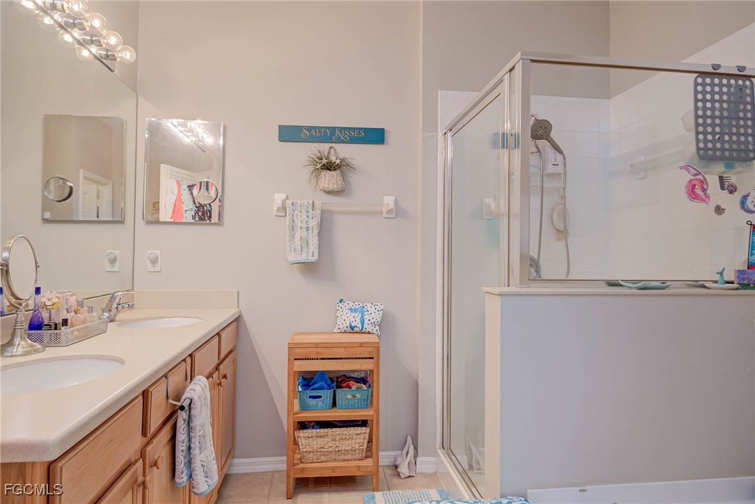 9005 Falcon Pointe Loop Fort Myers, FL 33912 - Photo 19 of 39 a bathroom with a sink and a mirror