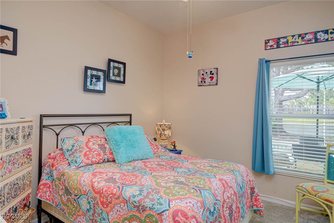 9005 Falcon Pointe Loop Fort Myers, FL 33912 - Photo 21 of 39 a bedroom with a bed and a window
