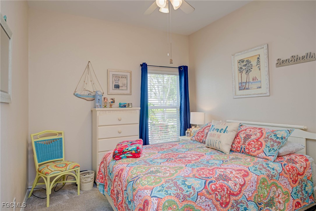 9005 Falcon Pointe Loop Fort Myers, FL 33912 - Photo 22 of 39 a bedroom with a bed and a table in it