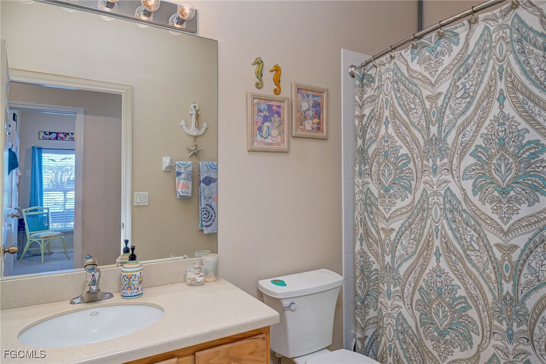 9005 Falcon Pointe Loop Fort Myers, FL 33912 - Photo 23 of 39 a bathroom with a toilet and a sink