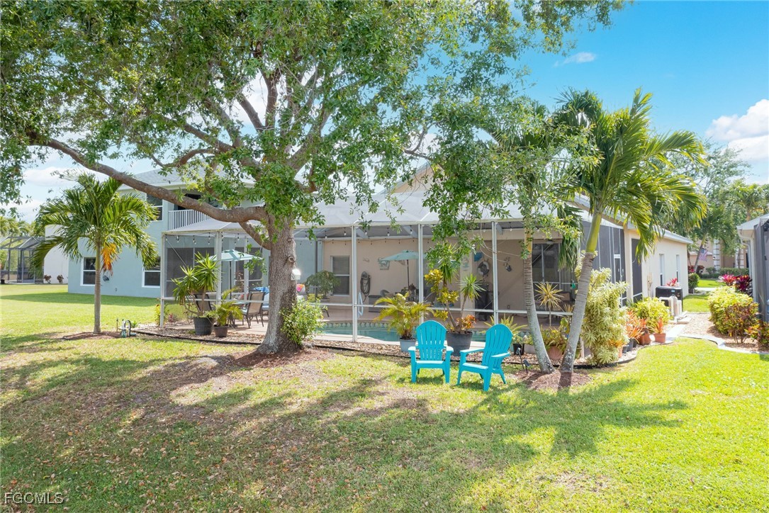 9005 Falcon Pointe Loop Fort Myers, FL 33912 - Photo 33 of 39 a view of a house with a backyard patio and swimming pool