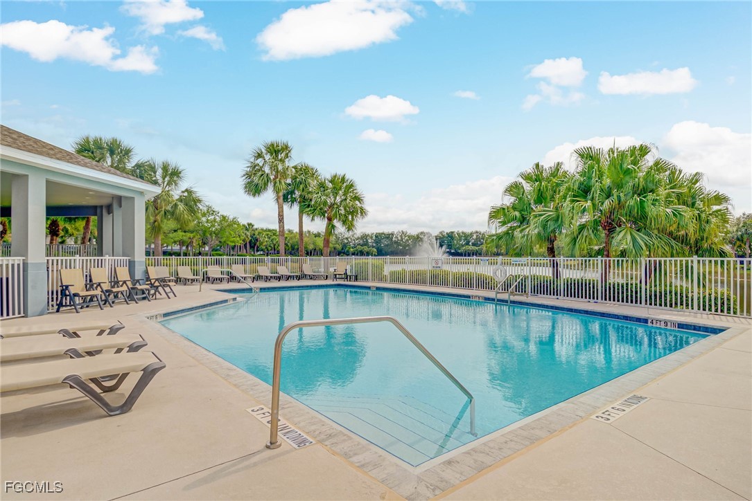 9005 Falcon Pointe Loop Fort Myers, FL 33912 - Photo 37 of 39 a view of a swimming pool with a lounge chair