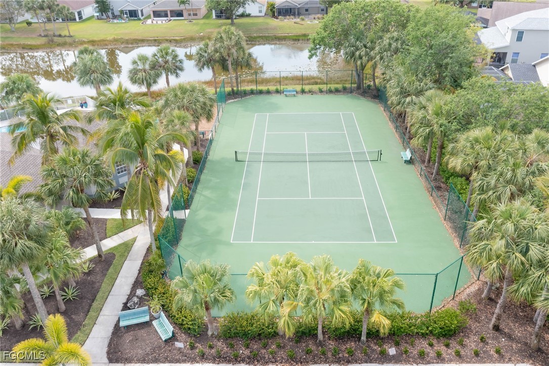 9005 Falcon Pointe Loop Fort Myers, FL 33912 - Photo 38 of 39 a view of a swimming pool with a yard and plants
