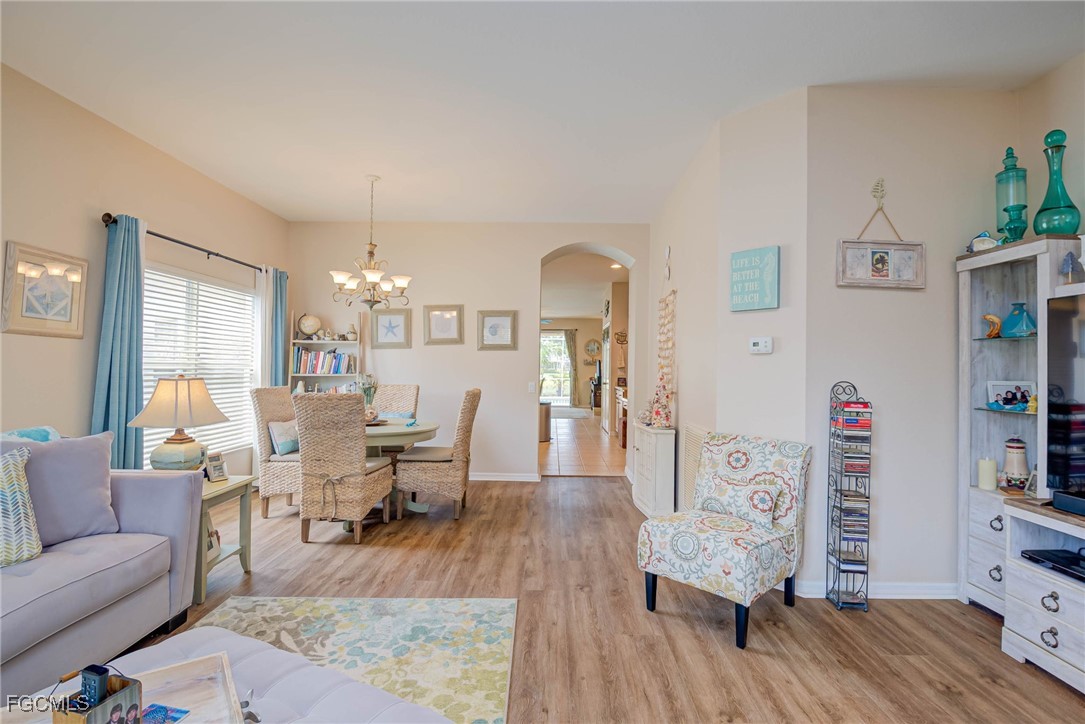 9005 Falcon Pointe Loop Fort Myers, FL 33912 - Photo 5 of 39 a living room with furniture and wooden floor