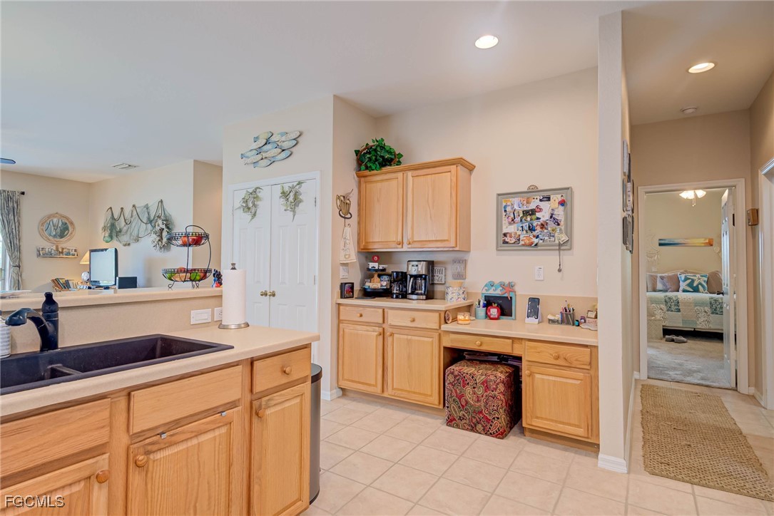 9005 Falcon Pointe Loop Fort Myers, FL 33912 - Photo 9 of 39 a kitchen with a sink and cabinets
