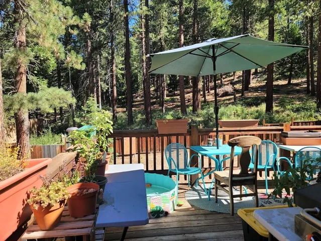 an outdoor space with furniture and umbrella