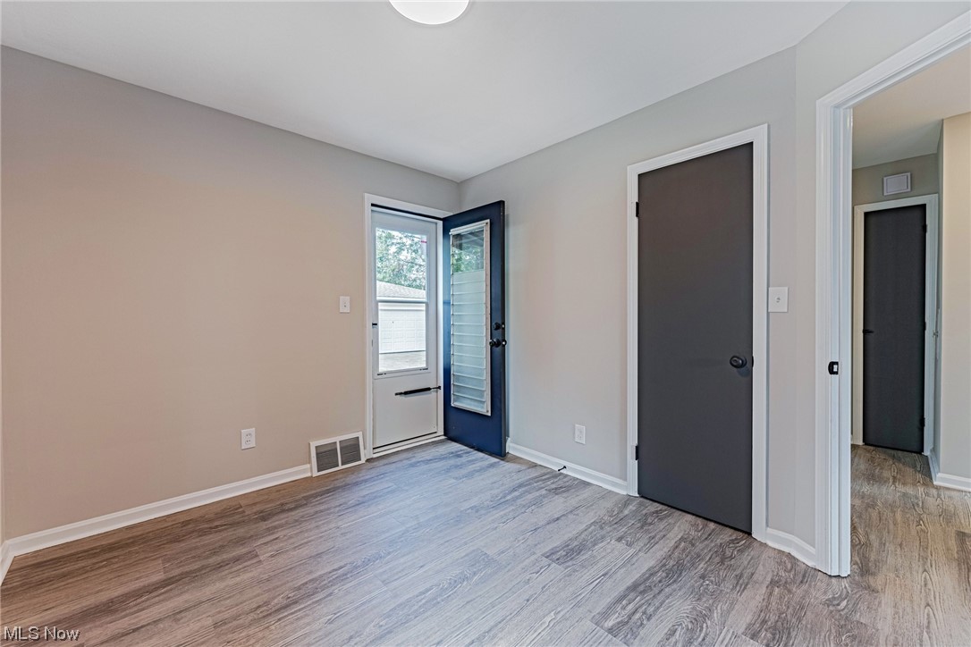 11815 Derby Road Garfield Heights, OH 44125 - Photo 13 of 31 Bedroom with light LVP floors