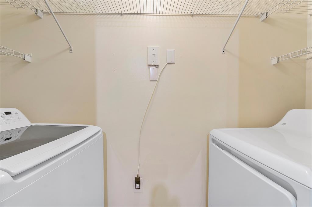 6020 West Sample Road, Unit 103 Coral Springs, FL 33067 - Photo 11 of 20 a utility room with dryer and washer
