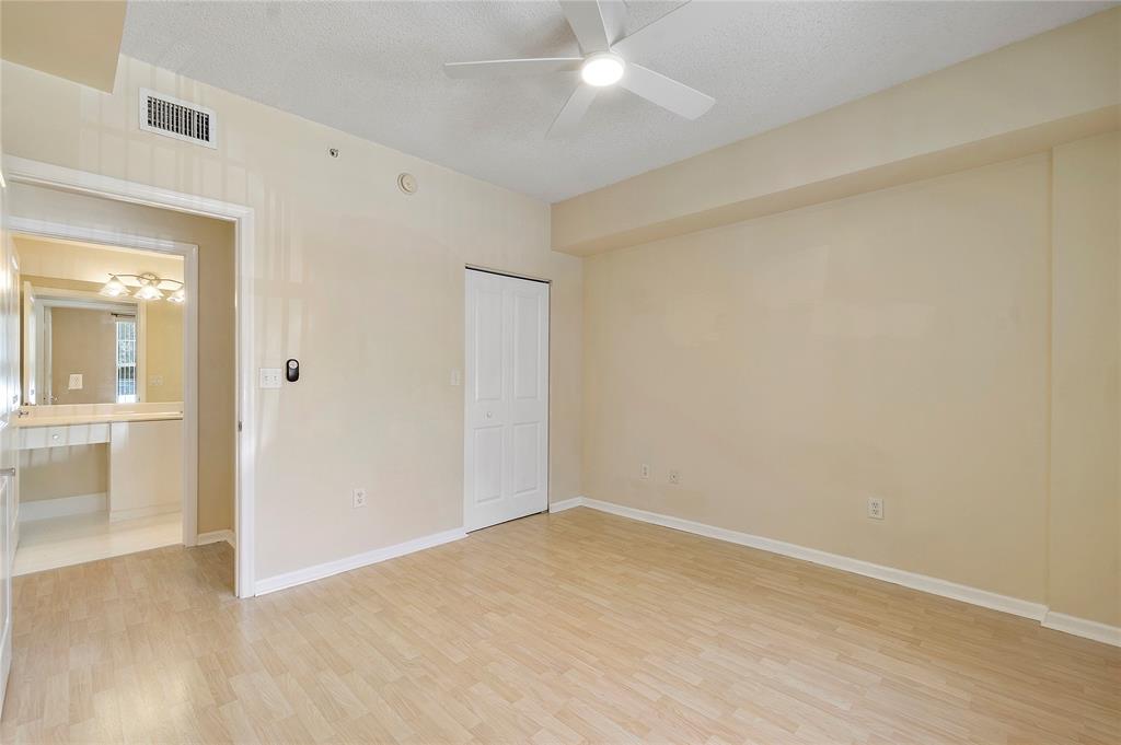 6020 West Sample Road, Unit 103 Coral Springs, FL 33067 - Photo 13 of 20 wooden floor in an empty room
