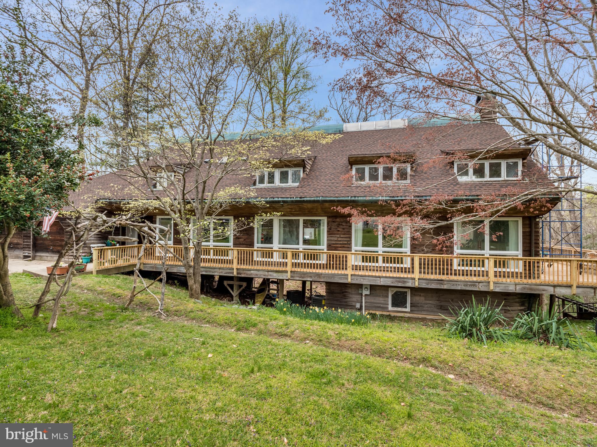 12466 Dalton Trail Lusby, MD 20657 - Photo 2 of 74 a view of a house with a yard and sitting area