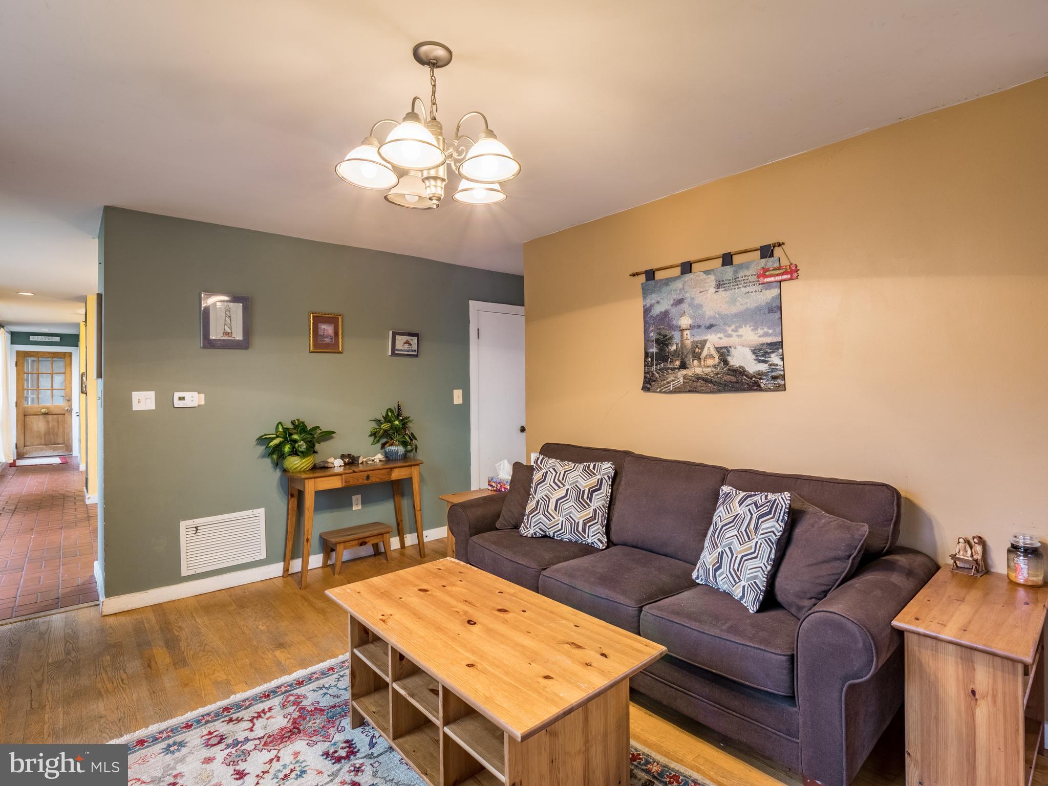 12466 Dalton Trail Lusby, MD 20657 - Photo 21 of 74 a living room with furniture and a dining table