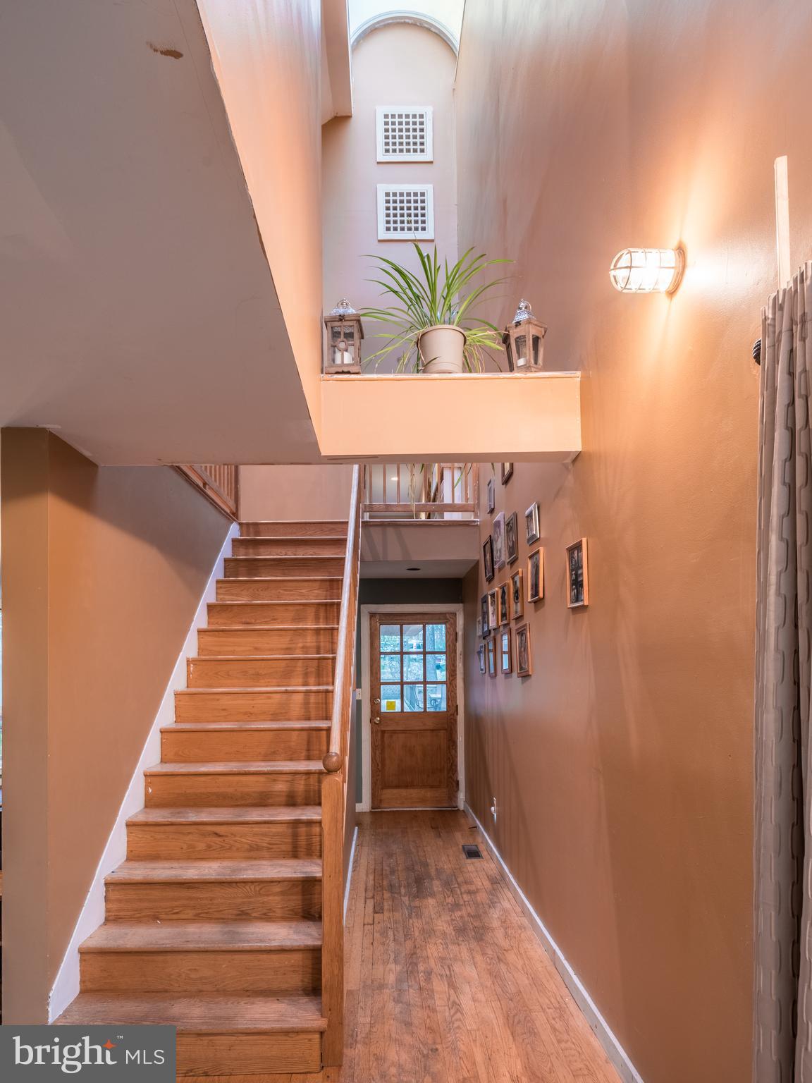 12466 Dalton Trail Lusby, MD 20657 - Photo 25 of 74 a view of entryway and hall with wooden floor