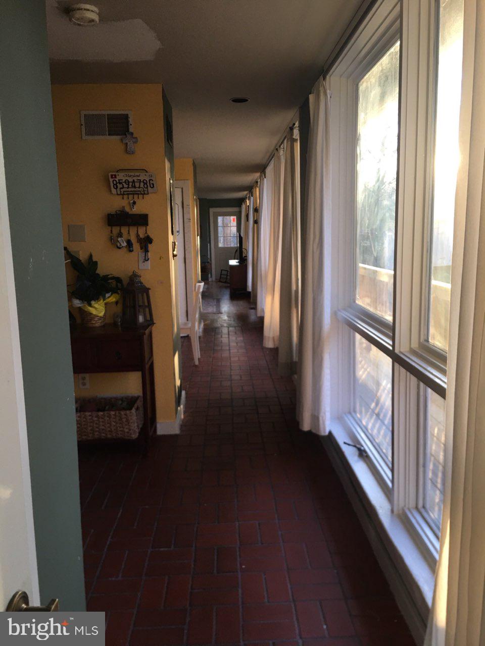 12466 Dalton Trail Lusby, MD 20657 - Photo 49 of 74 a view of a hallway with wooden floor and windows