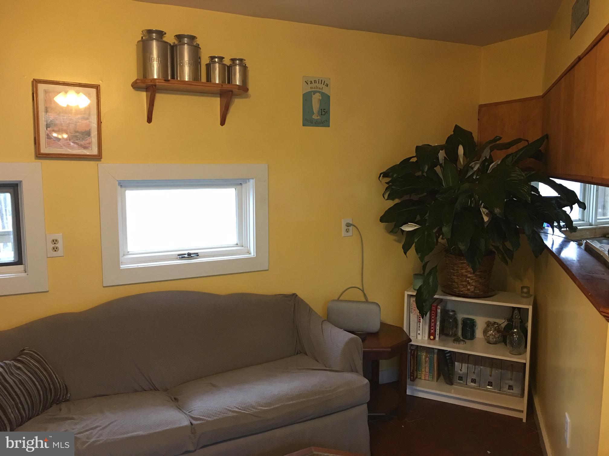 12466 Dalton Trail Lusby, MD 20657 - Photo 50 of 74 a living room with furniture and a window