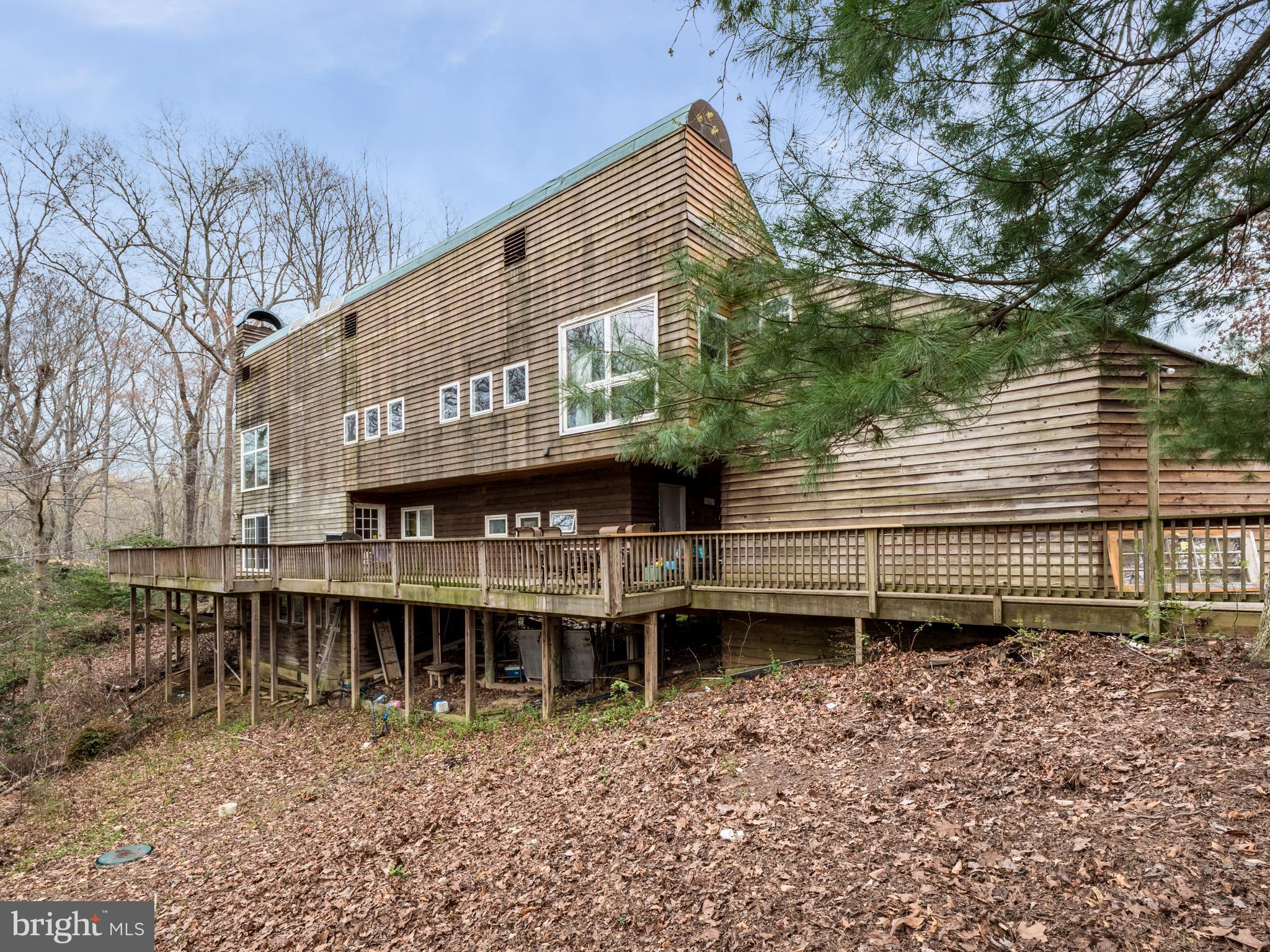 12466 Dalton Trail Lusby, MD 20657 - Photo 5 of 74 a view of a house with a yard and wooden deck