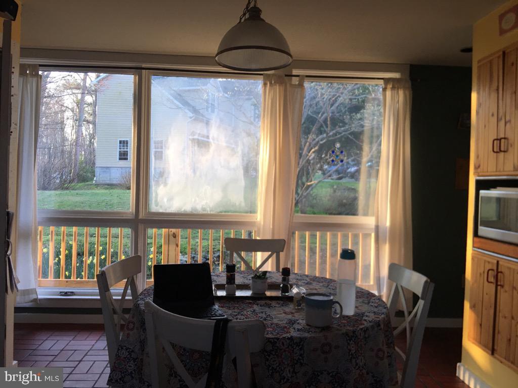 12466 Dalton Trail Lusby, MD 20657 - Photo 51 of 74 a view of a dining room with furniture window and outside view