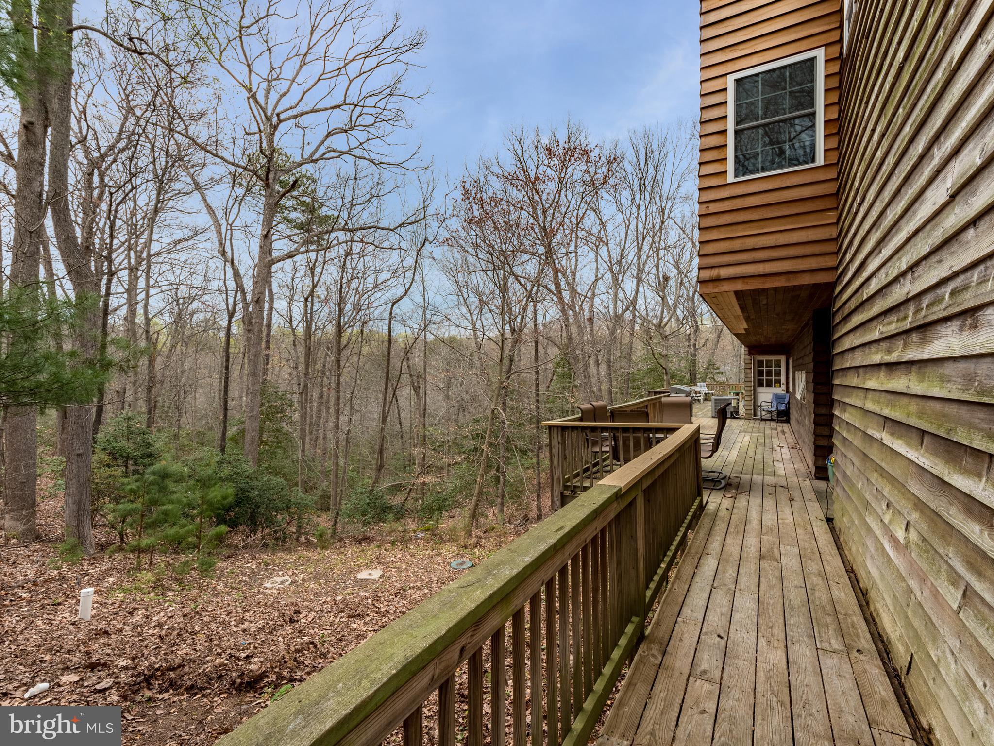 12466 Dalton Trail Lusby, MD 20657 - Photo 9 of 74 a view of balcony with lots of trees