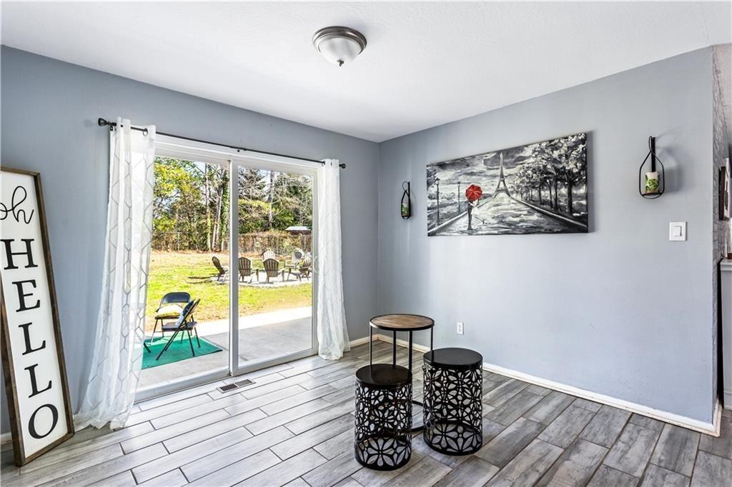 1646 Flicker Road Hampton, GA 30228 - Photo 14 of 38 a view of workspace with wooden floor