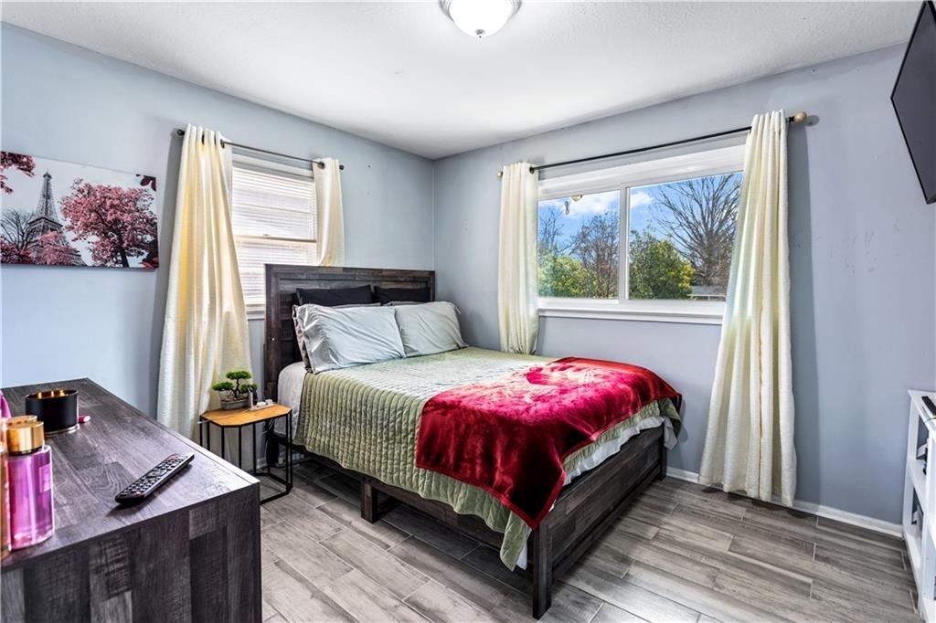 1646 Flicker Road Hampton, GA 30228 - Photo 23 of 38 a bedroom with a bed and window