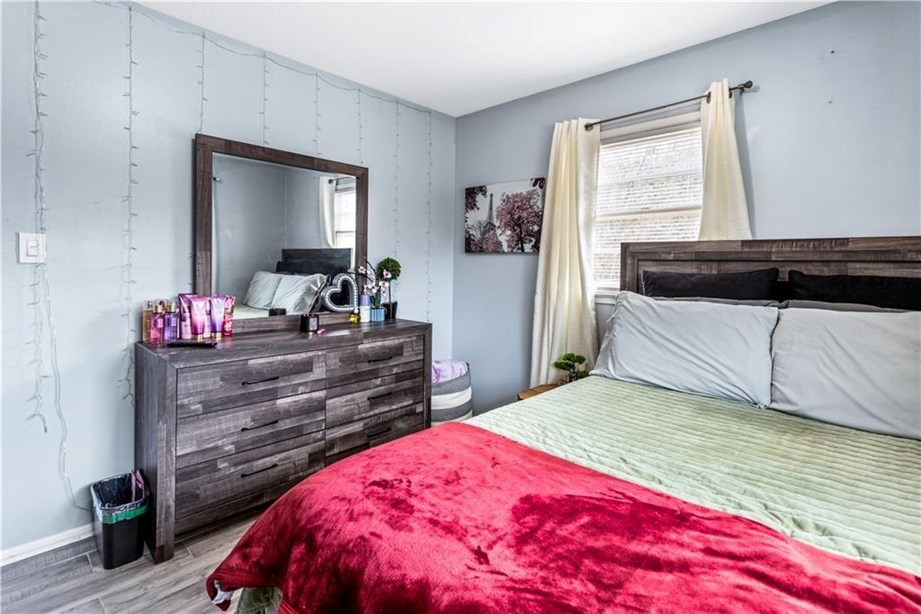 1646 Flicker Road Hampton, GA 30228 - Photo 24 of 38 a bedroom with a bed and a dresser