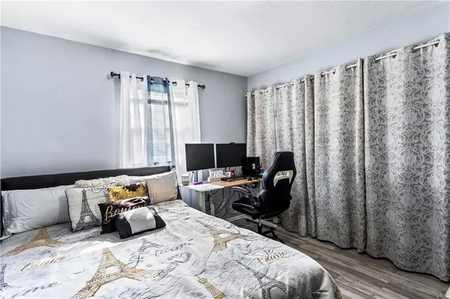 a bedroom with a bed and window