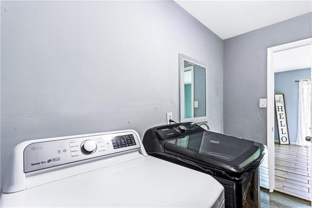 1646 Flicker Road Hampton, GA 30228 - Photo 38 of 38 a room with a sink a table and chairs