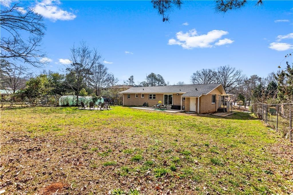 1646 Flicker Road Hampton, GA 30228 - Photo 7 of 38 a front view of house with yard and swimming pool