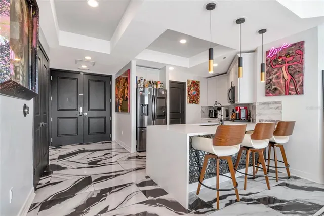 a bedroom with a bed and dresser with racks on the wall