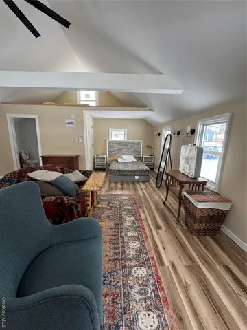 a bathroom with a granite countertop sink a toilet and a mirror
