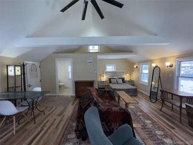 a bedroom with furniture and a chandelier