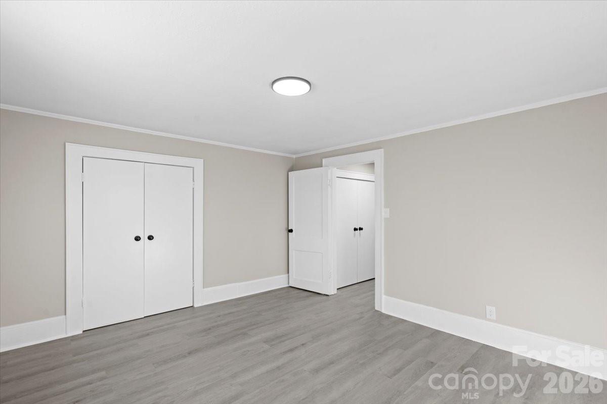 2217 Old Shelby Road Hickory, NC 28602 - Photo 14 of 20 a view of an empty room with wooden floor