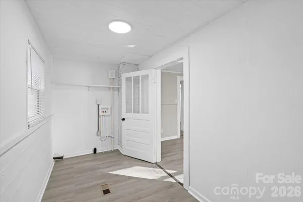 a view of entryway with white walls and white doors