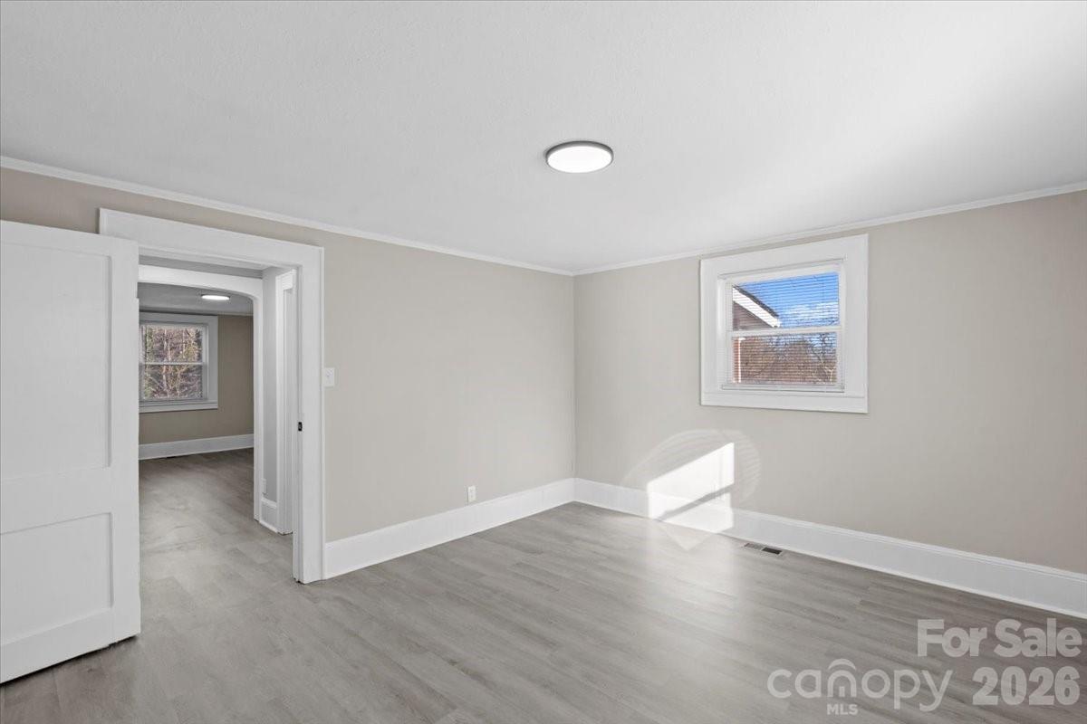 2217 Old Shelby Road Hickory, NC 28602 - Photo 6 of 20 a view of room with window and wooden floor