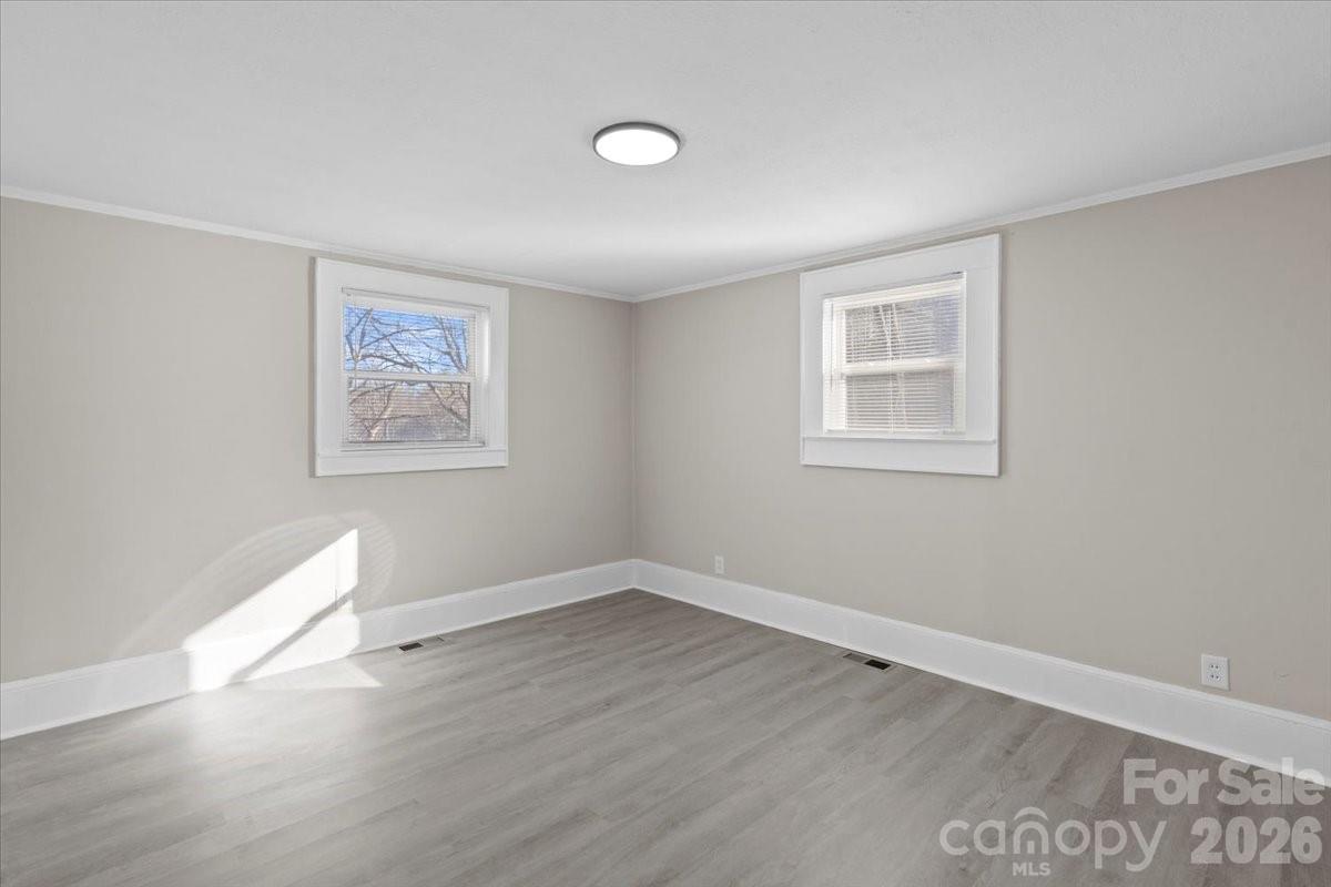2217 Old Shelby Road Hickory, NC 28602 - Photo 7 of 20 a view of empty room with wooden floor and fan
