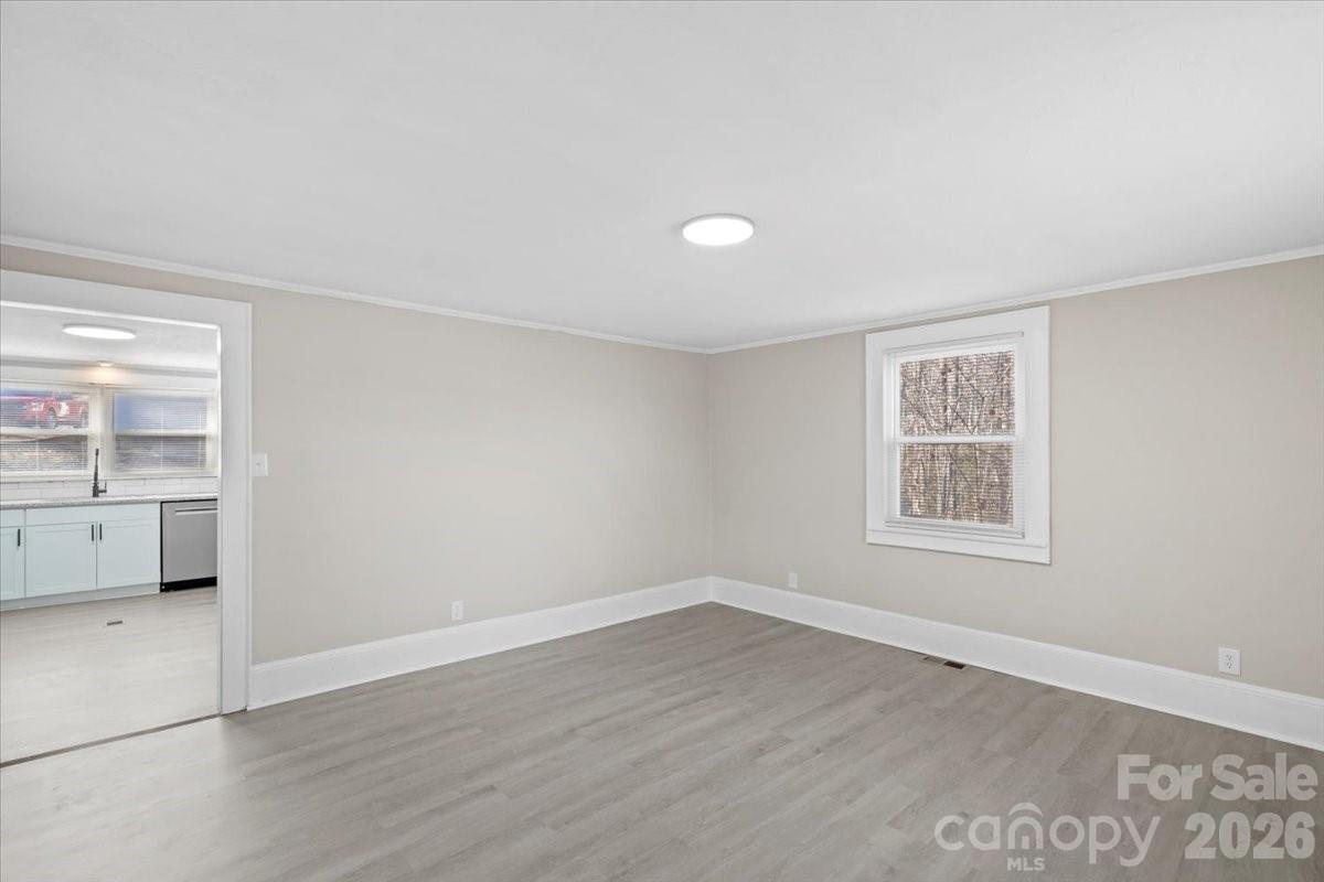 2217 Old Shelby Road Hickory, NC 28602 - Photo 8 of 20 wooden floor in an empty room with a window