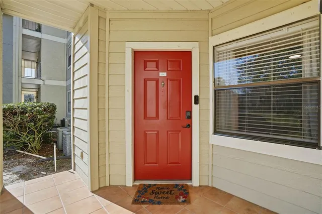 a view of a entryway door front of a house
