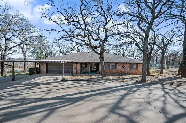 a view of a house with a snow in the yard