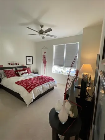 a bedroom with a bed and dresser