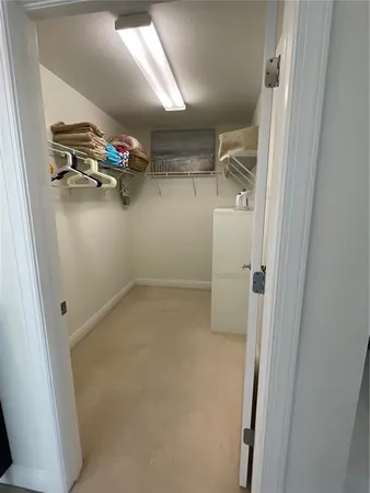 a view of storage and utility room with racks on the wall