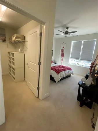 a bed room with a bed and a window