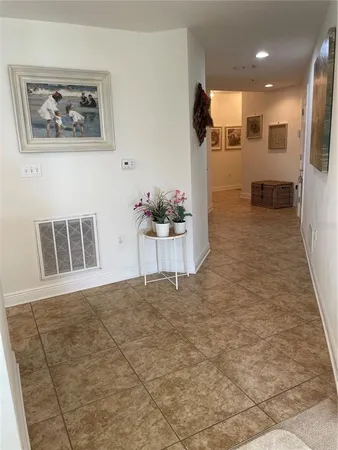 a view of a hallway with seating area