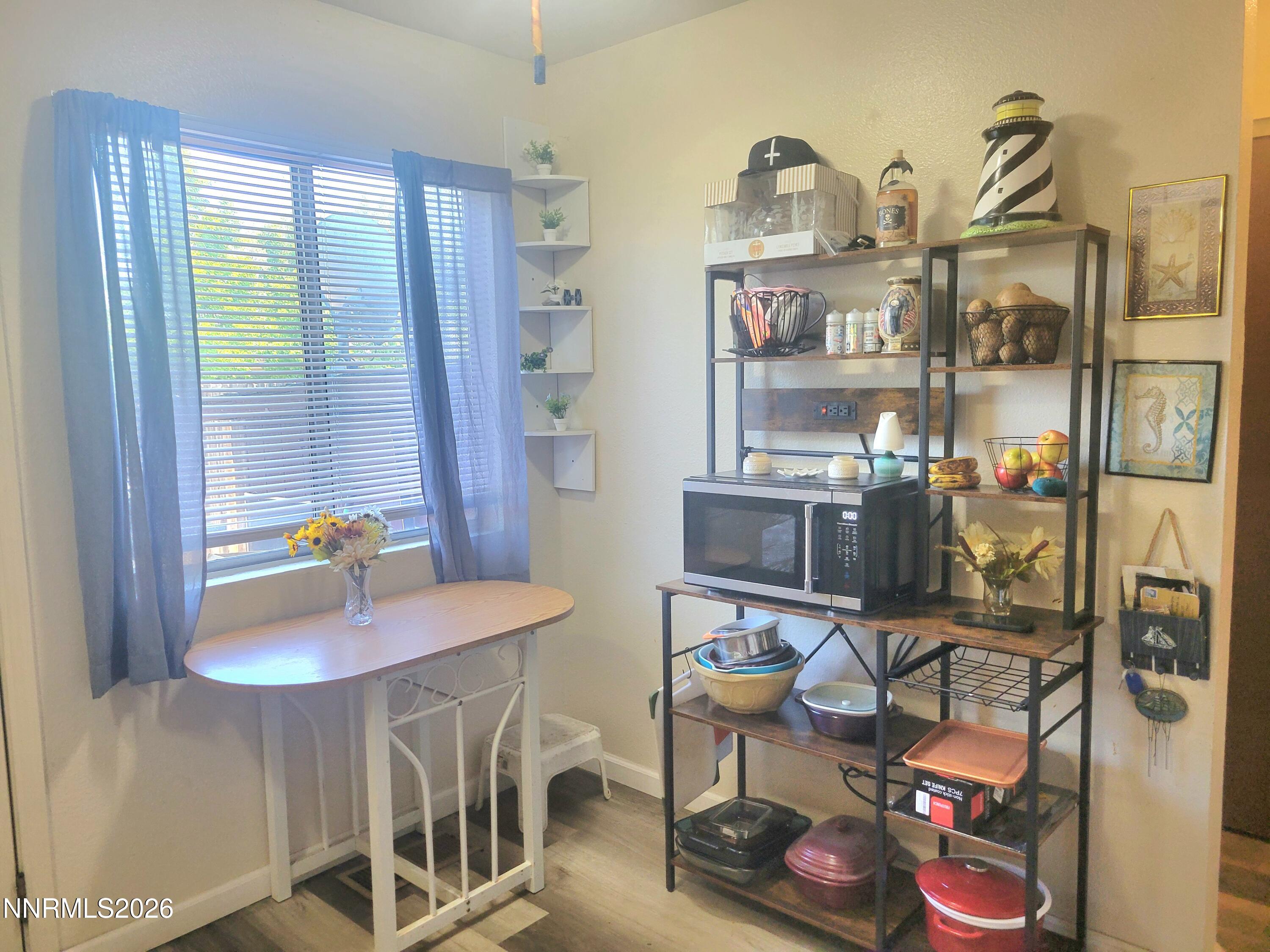 1404 East 9th Street, Unit 3 Reno, NV 89512 - Photo 9 of 29 a dining room with furniture and a window